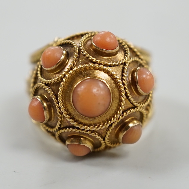 A 20th century yellow metal, coral bead and cannetile work set dress ring, size N/O